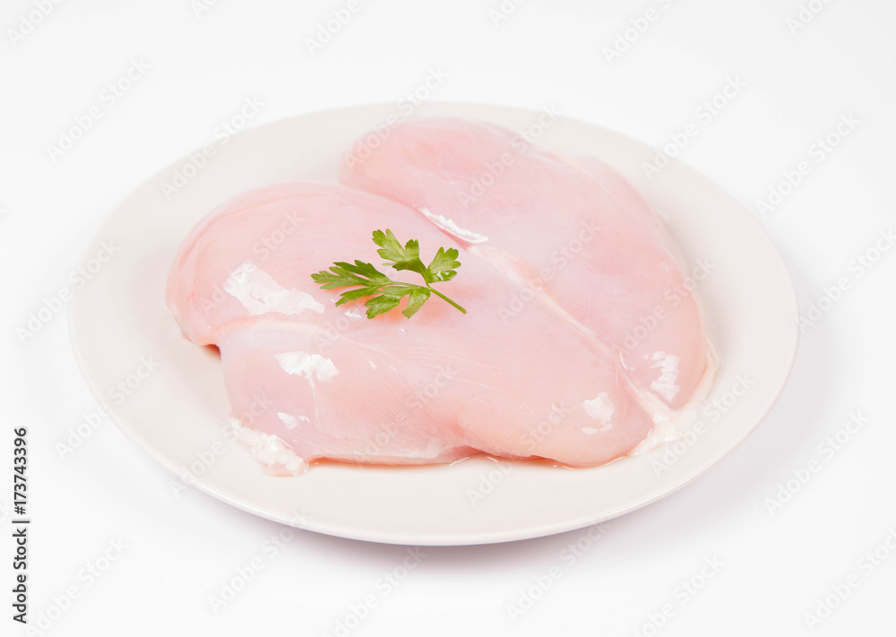 Raw chicken breast on a white background Raw chicken breast on a white background