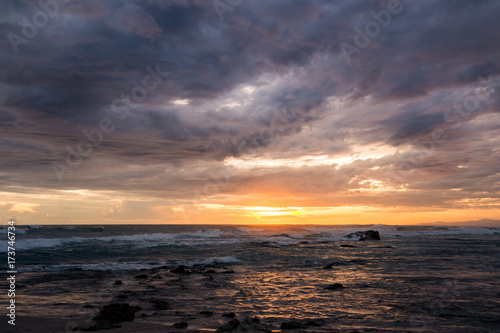 Sea scape waves sunset light glow and cloudy sky © Juhku