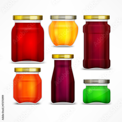 Set of natural jam preserves glass jars and metallic lids.