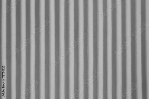 White and gray corrugated surface. Parallel lines pattern.