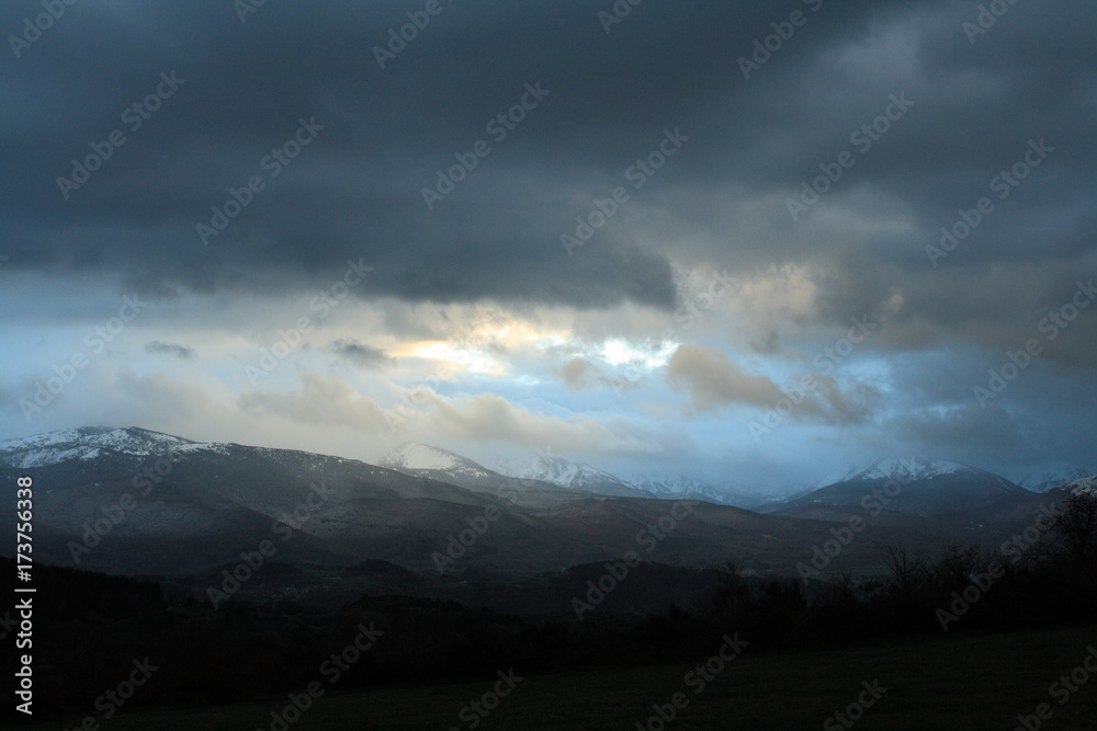 Dramatic landscape wtith cloudy sky in the French Pyrenees. Occitanie in south of France