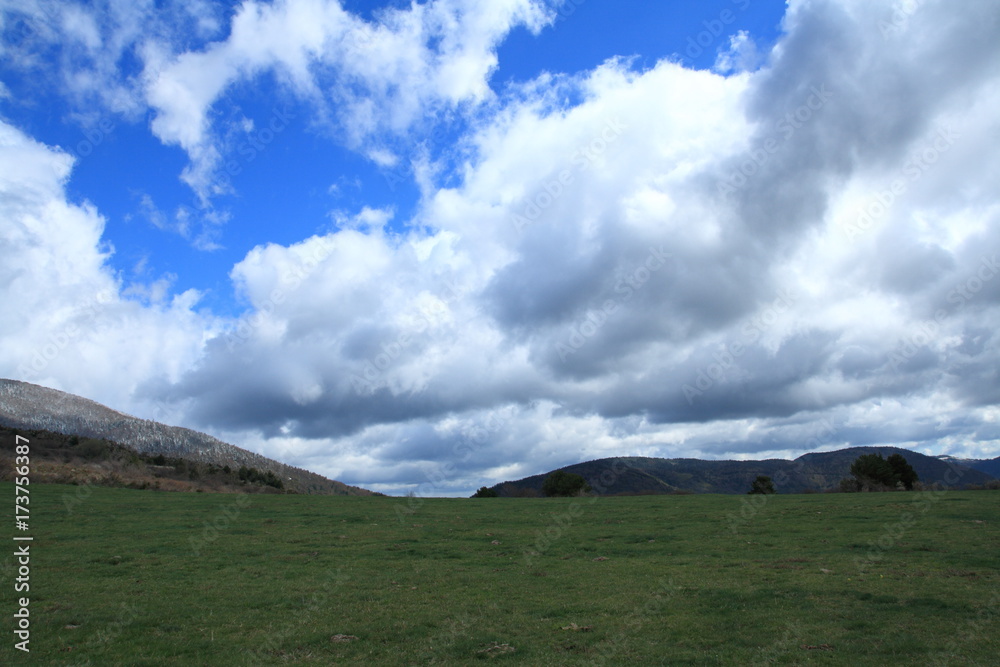 landscape and cloudy sky in Pyrenees. Occitanie in south of France landscape and cloudy sky in Pyrenees. Occitanie in south of France