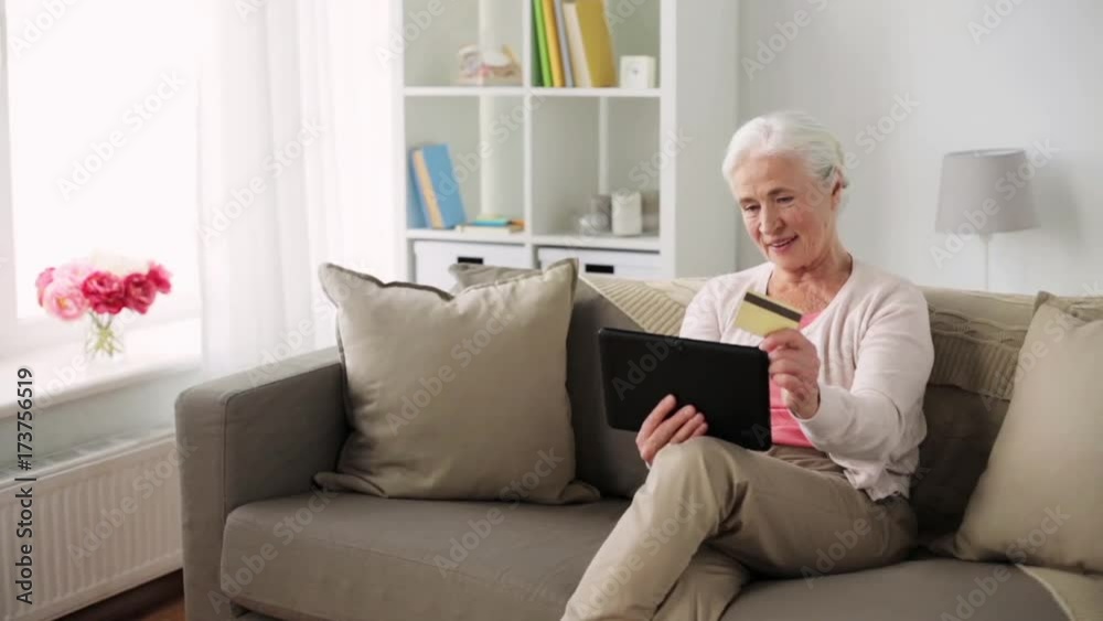 senior woman with tablet pc and credit card senior woman with tablet pc and credit card