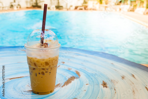 iced coffee with swimming pool photo