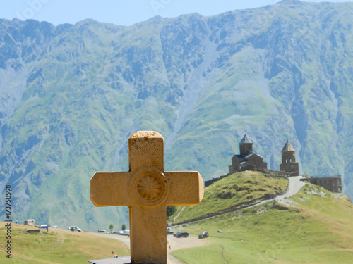 Gergeti Trinity Church  with Cross  - Khevi (Georgia) photo