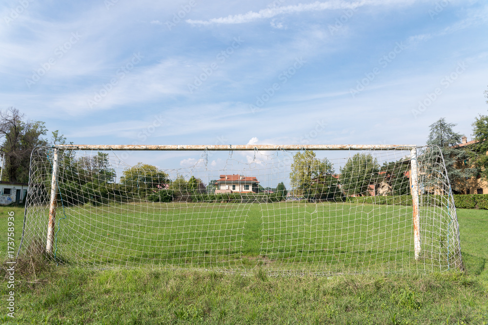 A football / soccer net on an empty field