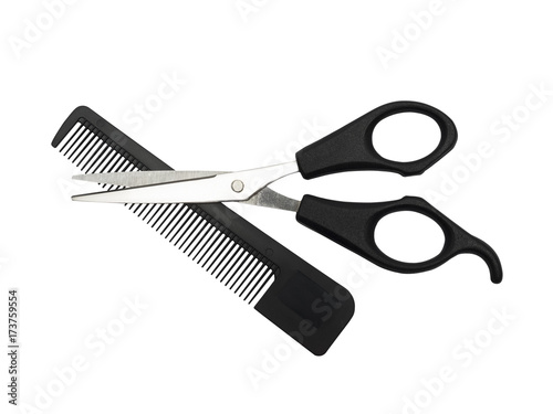 Haircutting scissors and hairbrush.