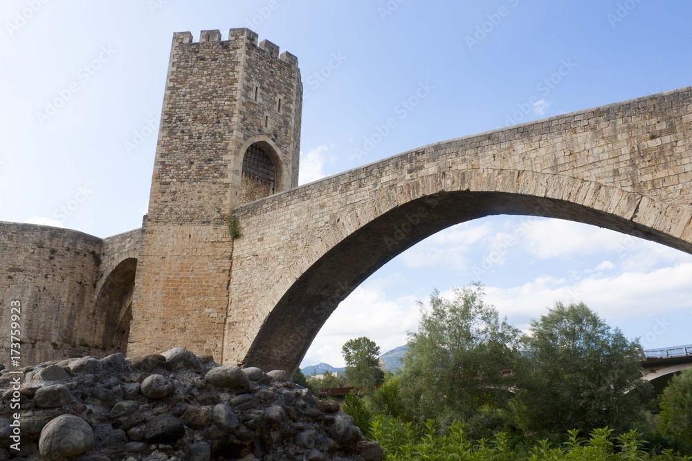tower and an arch with the sky behind, Spain