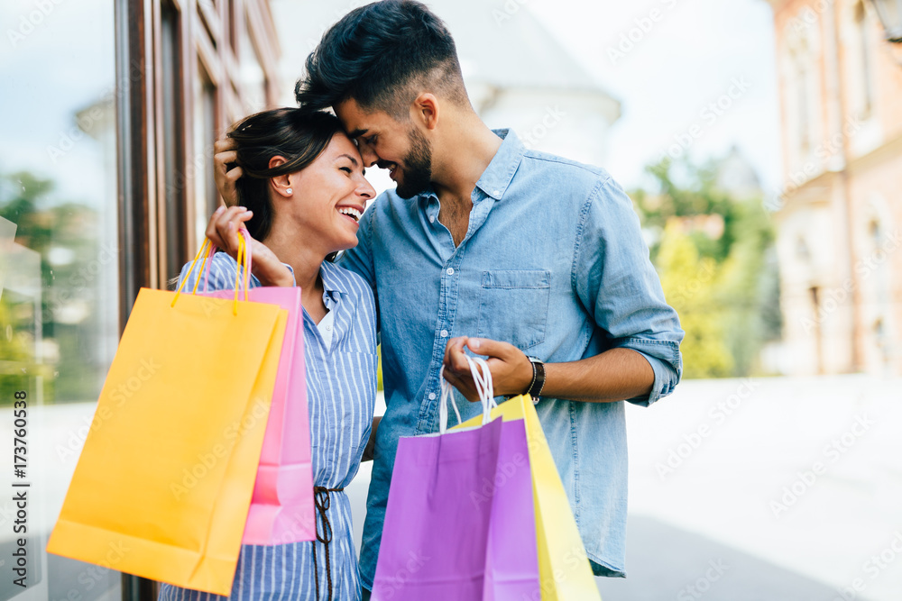 Happy attractive loving couple enjoy shopping together Happy attractive loving couple enjoy shopping together