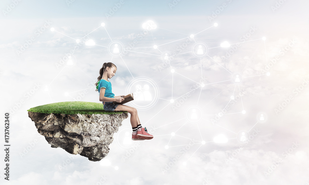 Concept of careless happy childhood with girl dreaming about something