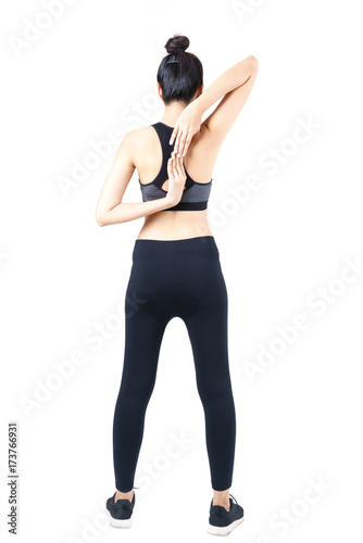 Young Asian woman in sportswear Stretching exercises for reducing pain from frozen shoulder and office syndrome
