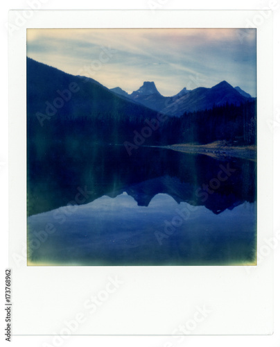Instant photograph of a pond & mountains photo