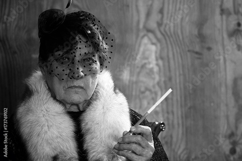 Retro grandmother smoking black and white photo