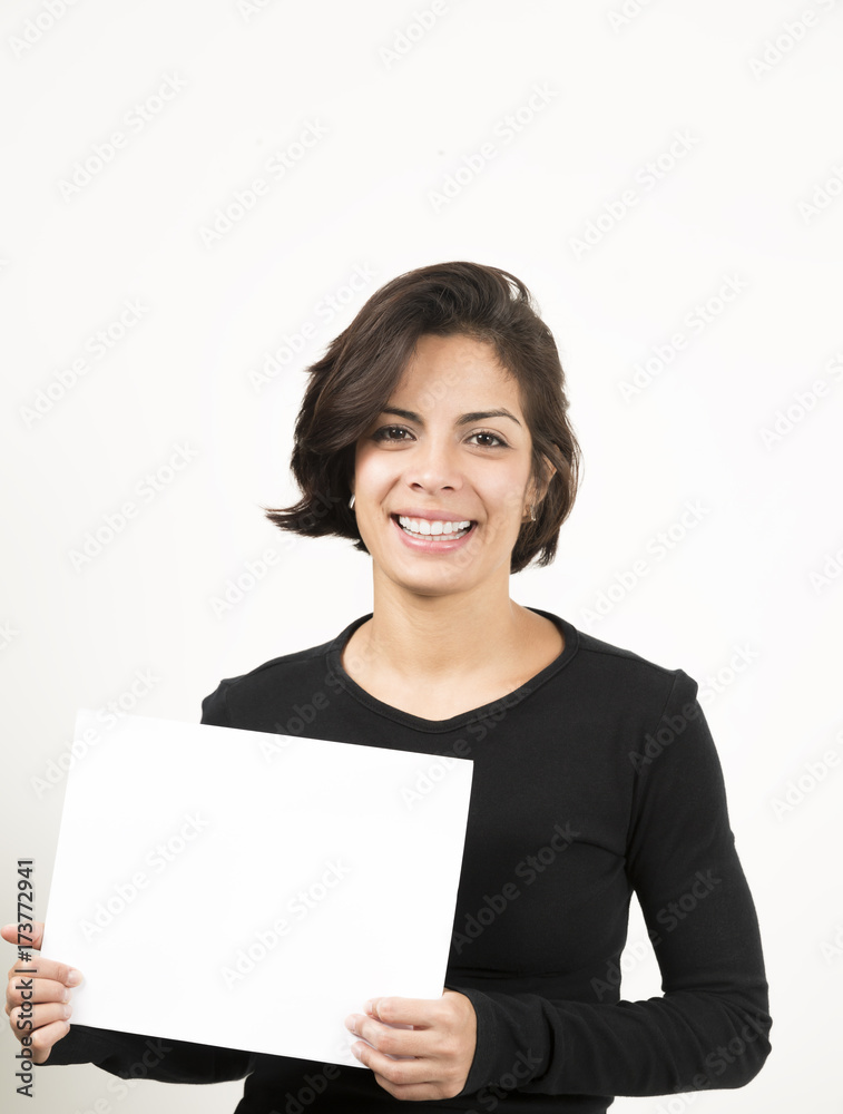 Beautiful young woman holding a blank sheet of paper Beautiful young woman holding a blank sheet of paper