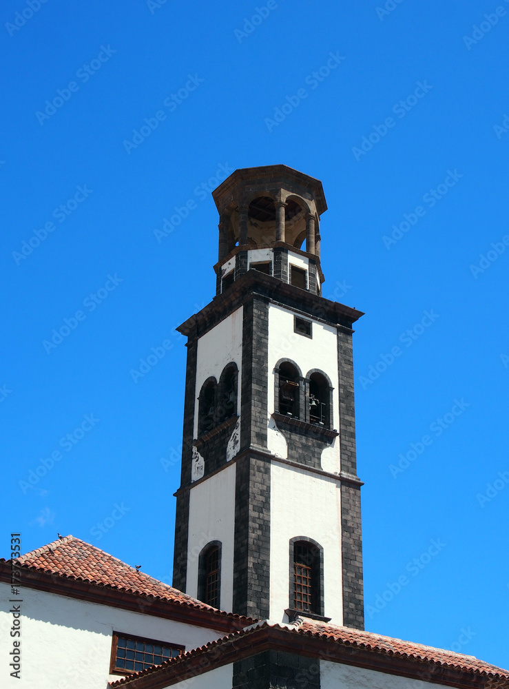 the old church in santa cruz tenerife with bell tower and blue sky