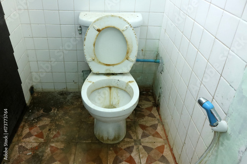 Dirty old toilets bowl and the bathrooms