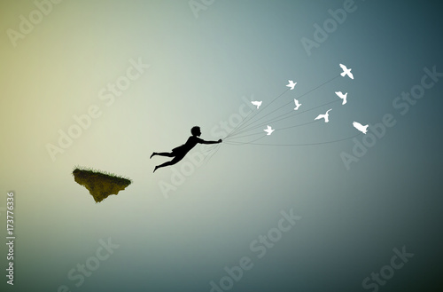 boy is flying away and holding pigeons, fly in the dream land,fly away, shadows,