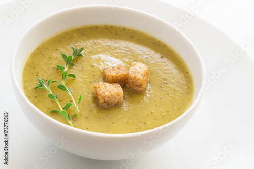 vegetable soup puree decorated with croutons and thyme