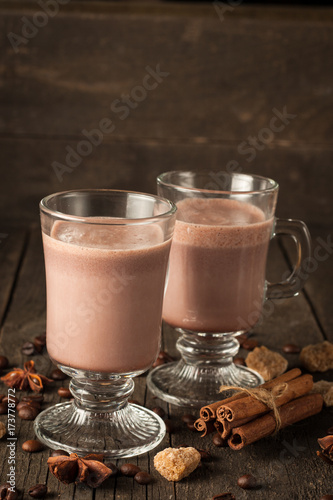 Chocolate, coffee, milk, banana shake on wooden background. Smoothie with cookies. Milkshake. Protein diet. Healthy food concept.