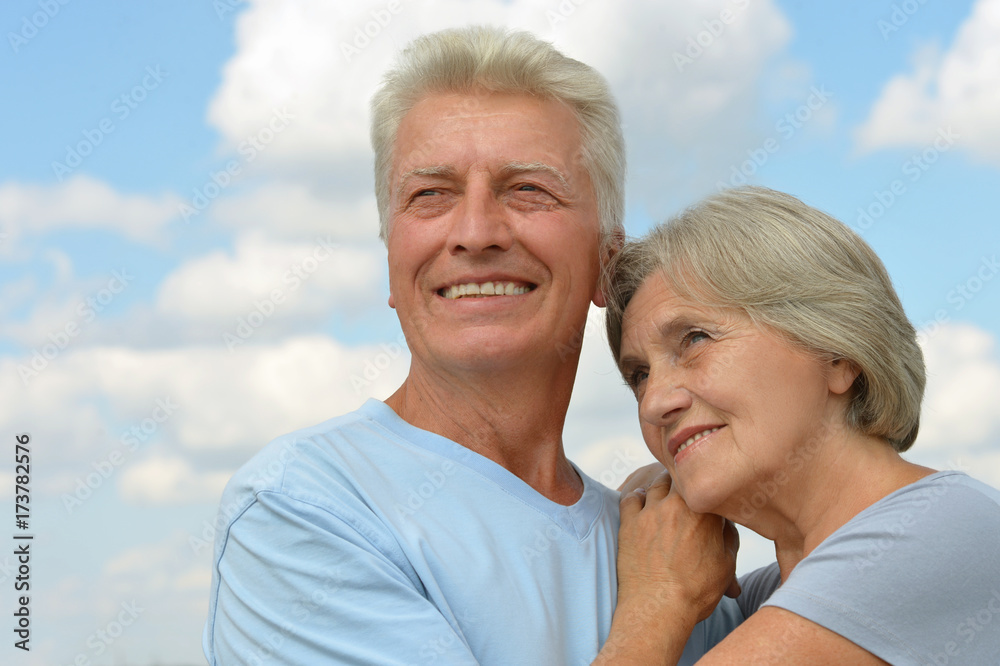 senior couple hugging outdoors