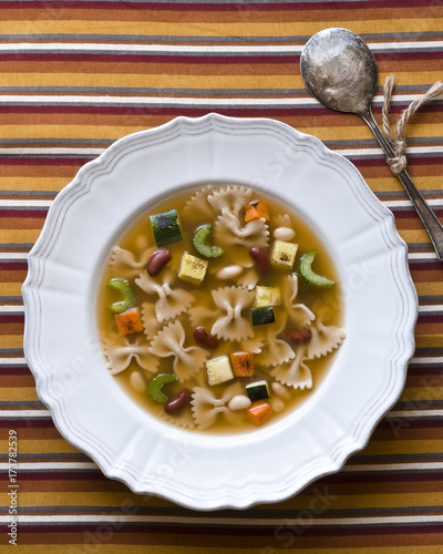 Delicious Minestone soup with noodles and roasted vegetables photo