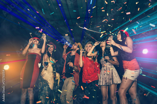Fun Party - Cheerful Meeting of Friends Enjoy Throwing Confetti and Dancing in Nightclub