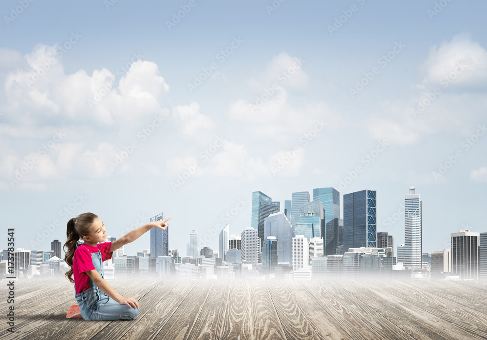 Concept of careless happy childhood with girl dreaming about something Concept of careless happy childhood with girl dreaming about something
