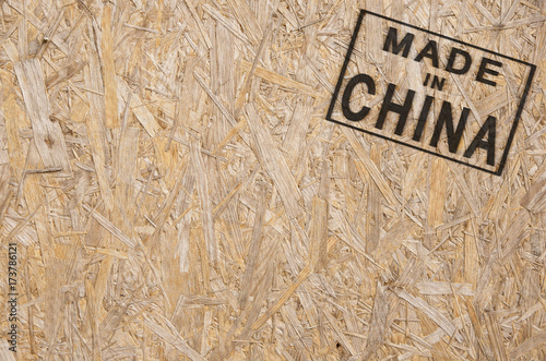 Canvas Print close-up of a brown pressed wood textured box with burn stamp Made in China on i
