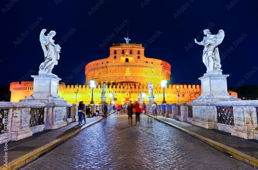 View of the Castel Sant'Angelo and Aelian Bridge in Rome at night.