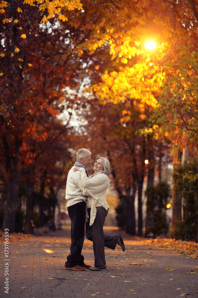 elderly couple in autumnal forest