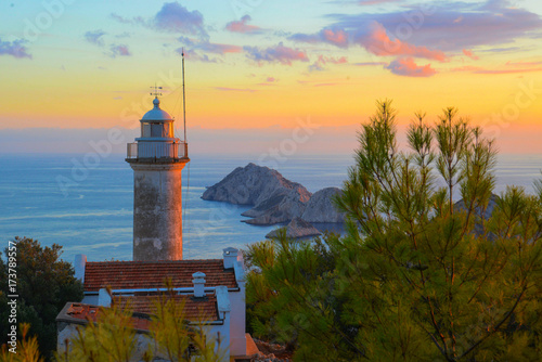 Lighthouse Gelidonya Feneri on sunset. ( Kemer). Lovely place of tourists. Lycian way. Walking tour photo