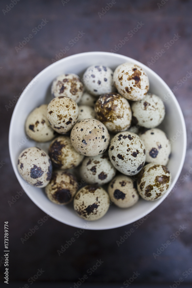 Quail eggs in a small basket