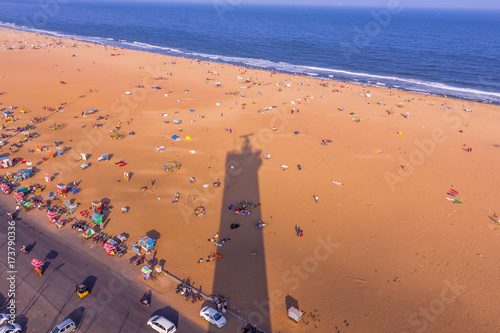 Birds eye view from light house and the shadow of light house, Marina Beach, Chennai. Its longest natural urban beach in India and one of the world's longest beach ranking.