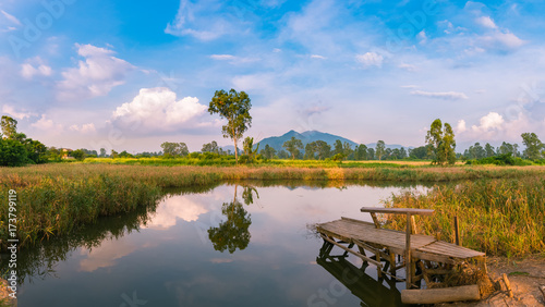 Beautiful Mirror reflection lake and old wooden fishing Jetty in Nam Sang Wai, Yuen Long, New Territories, Hong Kong, China