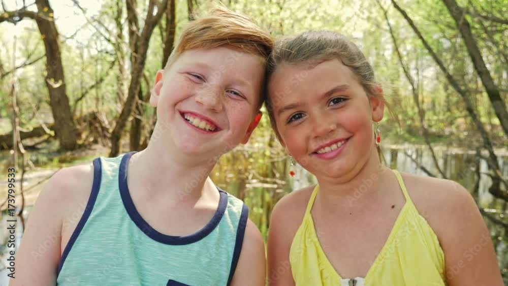 Portrait of a little girl on a yellow background. with his friend Portrait of a little girl on a yellow background. with his friend