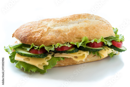 Ciabatta sandwich with salad, tomato, cucumber and cheese isolated on white
