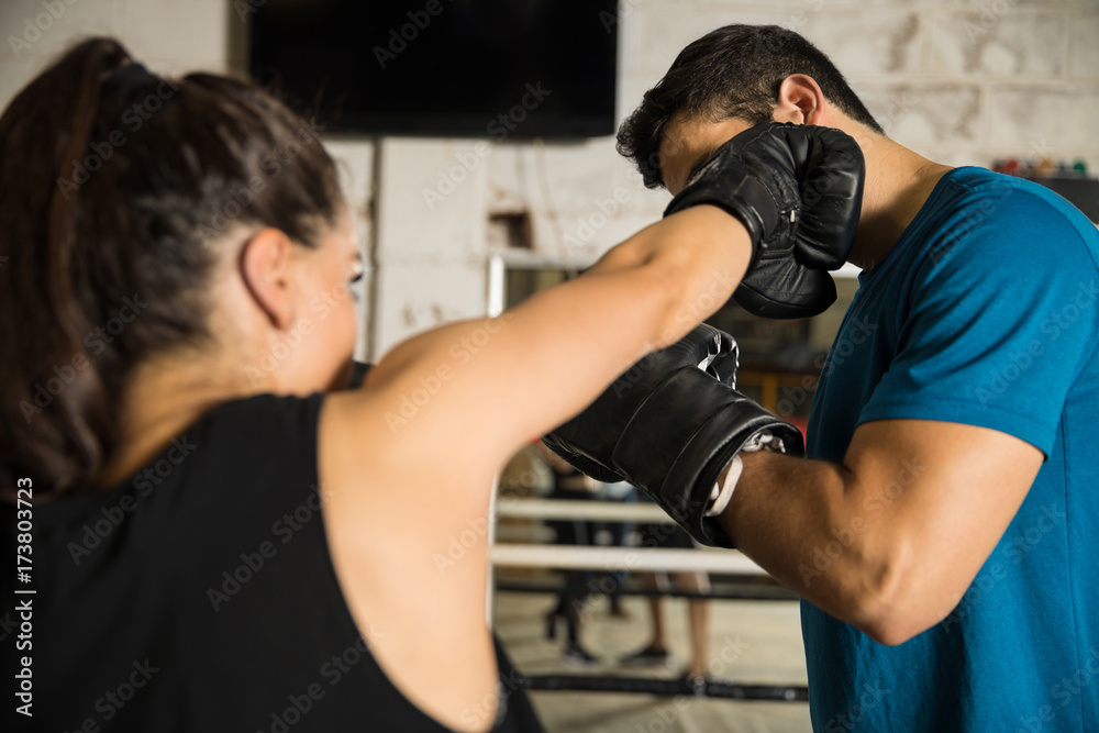 Man getting hit by a female boxer Man getting hit by a female boxer