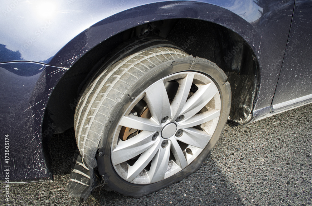 damaged tire after tire explosion at high speed on highway