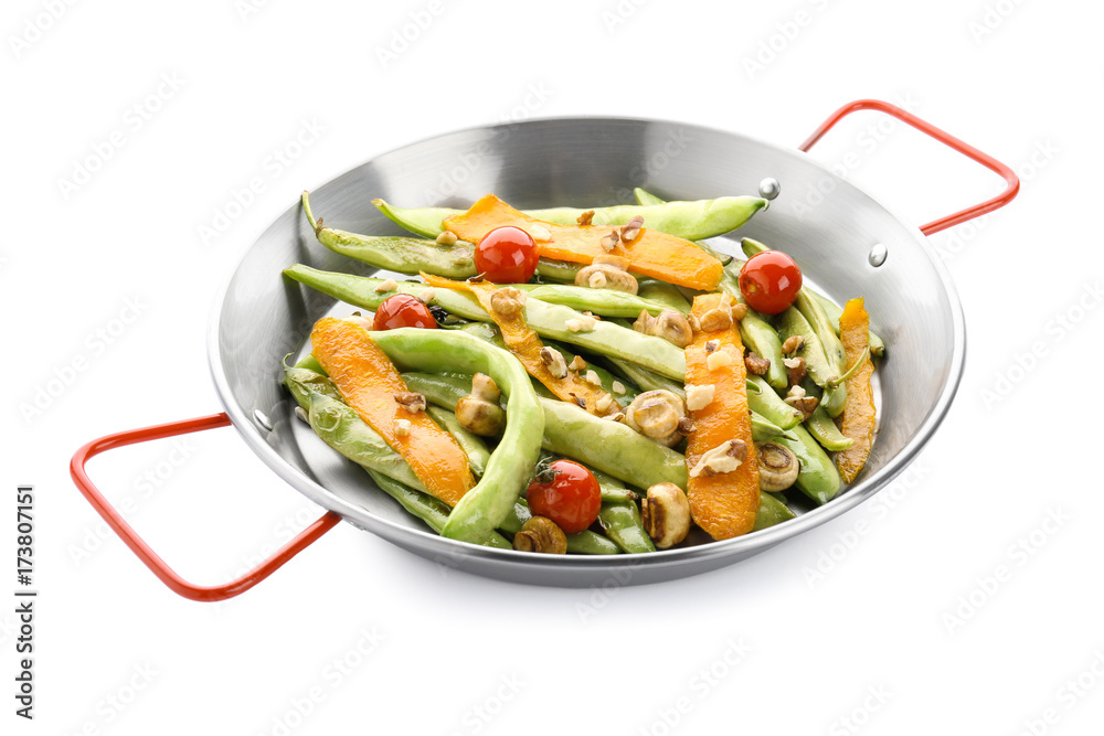 Frying pan with delicious green beans, carrot and cherry tomatoes on white background Frying pan with delicious green beans, carrot and cherry tomatoes on white background