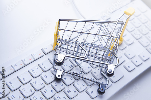 Online shopping trolley on keyboard