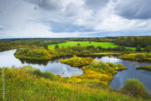 Fototapeta Naklejka Na Ścianę i Meble -  Beautiful autumn rural scenery. A big river with Islands