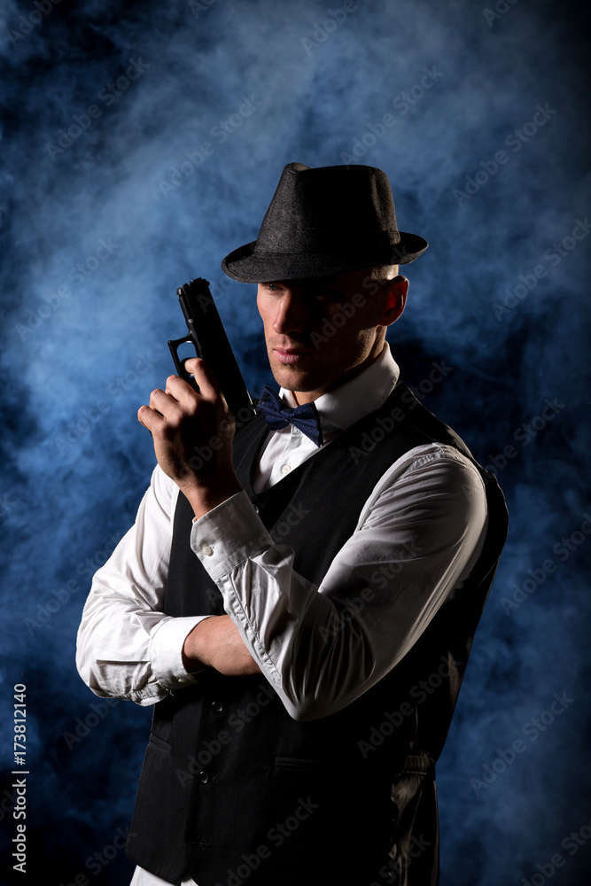 detective or criminal with gun on foggy night background detective or criminal with gun on foggy night background
