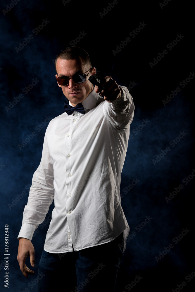 detective or criminal with gun on foggy night background detective or criminal with gun on foggy night background