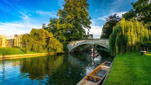 Tourists on punt trip (sightseeing with boat) along River Cam near Kings College in the city of Cambridge, United Kingdom photo