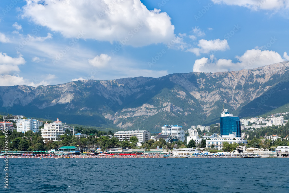 Fototapeta premium Views of the Crimean coastline with hotels and beaches with mountains in the background.