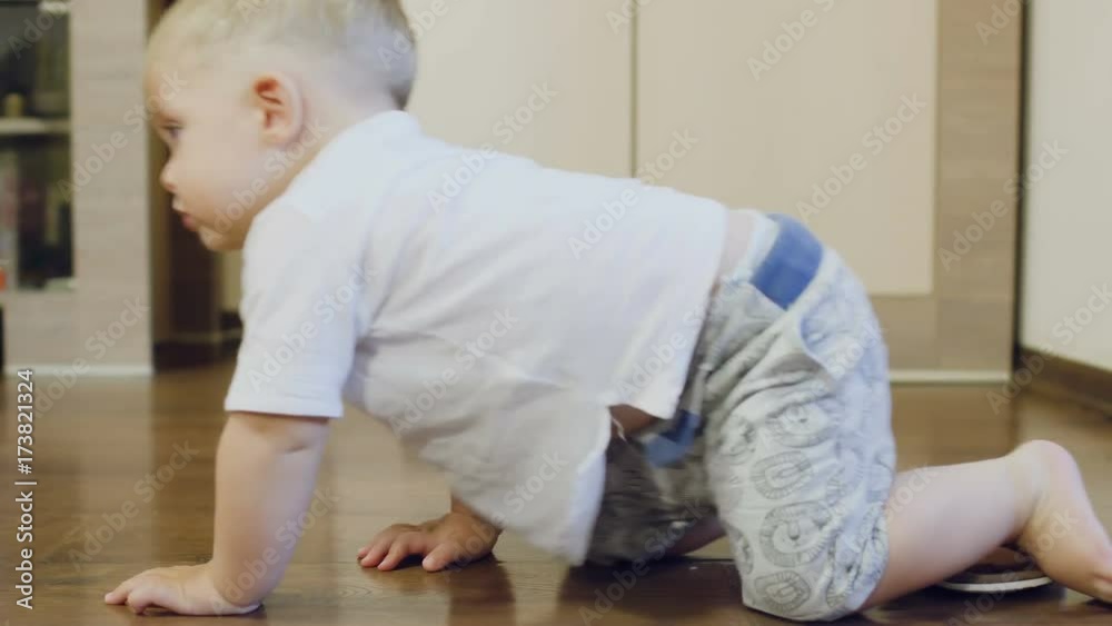 Pretty boy crawls over the parquet Pretty boy crawls over the parquet