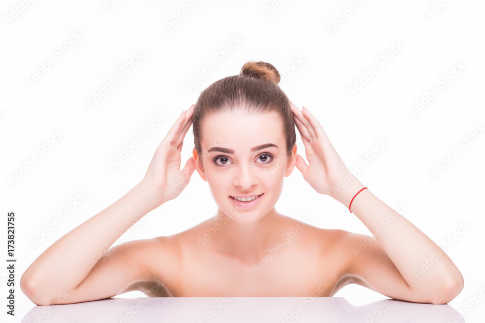 Beauty Portrait. Beautiful woman touching her face and looking at camera. Isolated over white background. Beauty Portrait. Beautiful woman touching her face and looking at camera. Isolated over white background.
