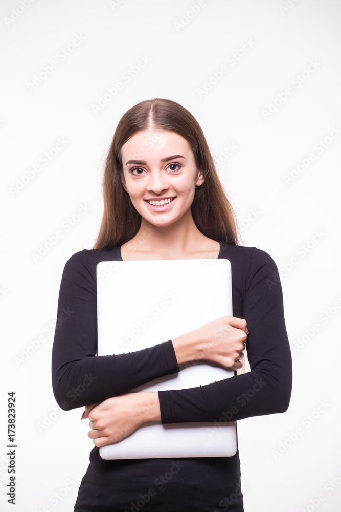 Beautiful woman standing with laptop on a white isolated background Beautiful woman standing with laptop on a white isolated background