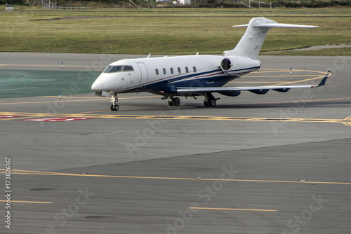 business jet airplane or aircraft on airfield near of aeroport terminal parking departure arrival
