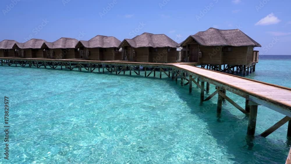 Tropical travel card with water bungalows at maldivian island Tropical travel card with water bungalows at maldivian island